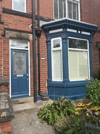 Exterior of a traditional  Victorian terrace album cover