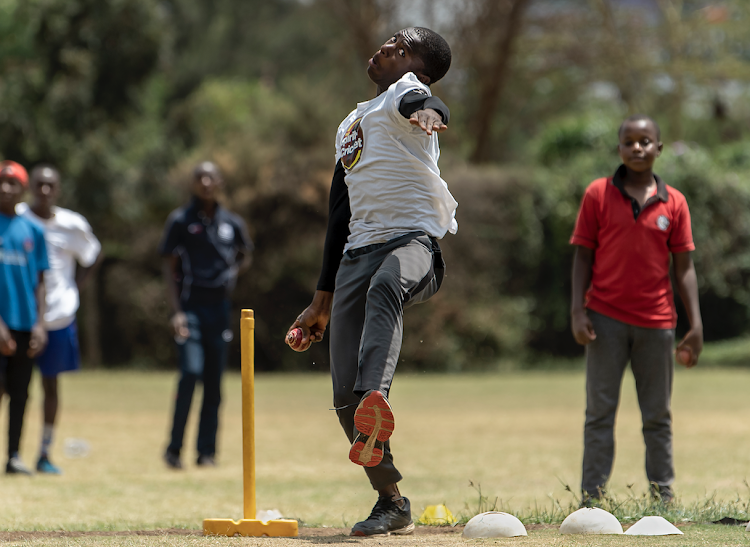Young learners takes part in bowling practice during a training session by former Kenya national wicket-keeper, David Obuya at the Obuya Cricket Academy grounds in Nairobi