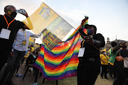 ANC supporters wave the ANC and LGBTQI flag as the party gears up to launch its election manifesto.