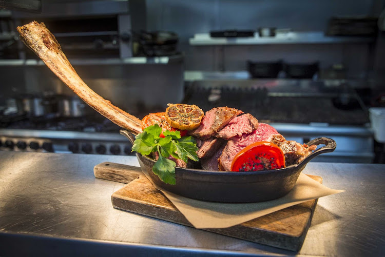 Tomahawk steak at Hutchesons Bar and Brasserie in Glasgow, Scotland.