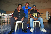 Boxing trainers Norman Hlabane, Lehlohonolo Ledwaba and boxer Khaya Busakwe at Soweto. 