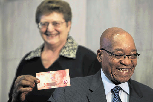 South African Reserve Bank governor Gill Marcus and President Jacob Zuma with the country's new currency - after a slight panic over the announcement