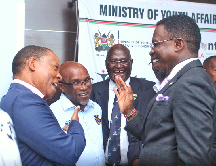 Sport CS Ababu Namwamba enjoys a light moment with new Safari Rally CEO Charles Gacheru (L), KMSF chair Maina Muturi (2nd L) and businessman Peter Kuguru in a recent event.