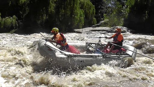 Graeme Addison, right, takes a client whitewater rafting on the Vaal in Parys.