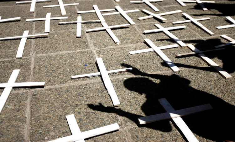 Family members gather outside the Gauteng health department in Johannesburg at a vigil on October 27 2016 for 37 patients who died after the department moved them from the Life Healthcare Esidimeni psychiatric hospital to community-based NGO care centres. Picture: SOWETAN