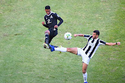 Vincent Pule of Orlando Pirates and Nemdil Abdelkrim of ES Setif during their CAF Confederation Cup match at Orlando Stadium on Wednesday April 21 2021 in Johannesburg. 