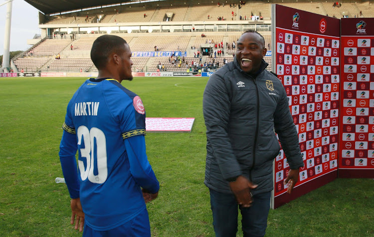 Cape Town City head coach Benni McCarthy all smiles alongside goal hero Craig Martin who scored a late equaliser during the Absa Premiership match against Orlando Pirates.