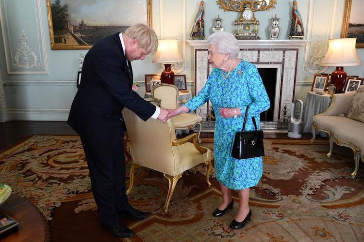 Queen Elizabeth welcomes Boris Johnson during an audience in Buckingham Palace, where she will officially recognize him as the new prime minister, in London, July 24, 2019.