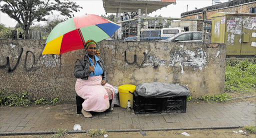 NO SUN, NO FUN: Vendor Yolisa Mkence at her stall in Berlin Picture: MBALI TANANA