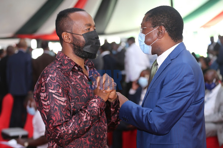 Mombasa Governor Hassan Joho confers with Bungoma Senator Moses Wetangula on November 25, 2020, during the launch of the BBI signature drive at the KICC in Nairobi. Photo/Fredrick Omondi