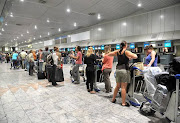 Passengers at OR Tambo airport in Johannesburg. File photo.