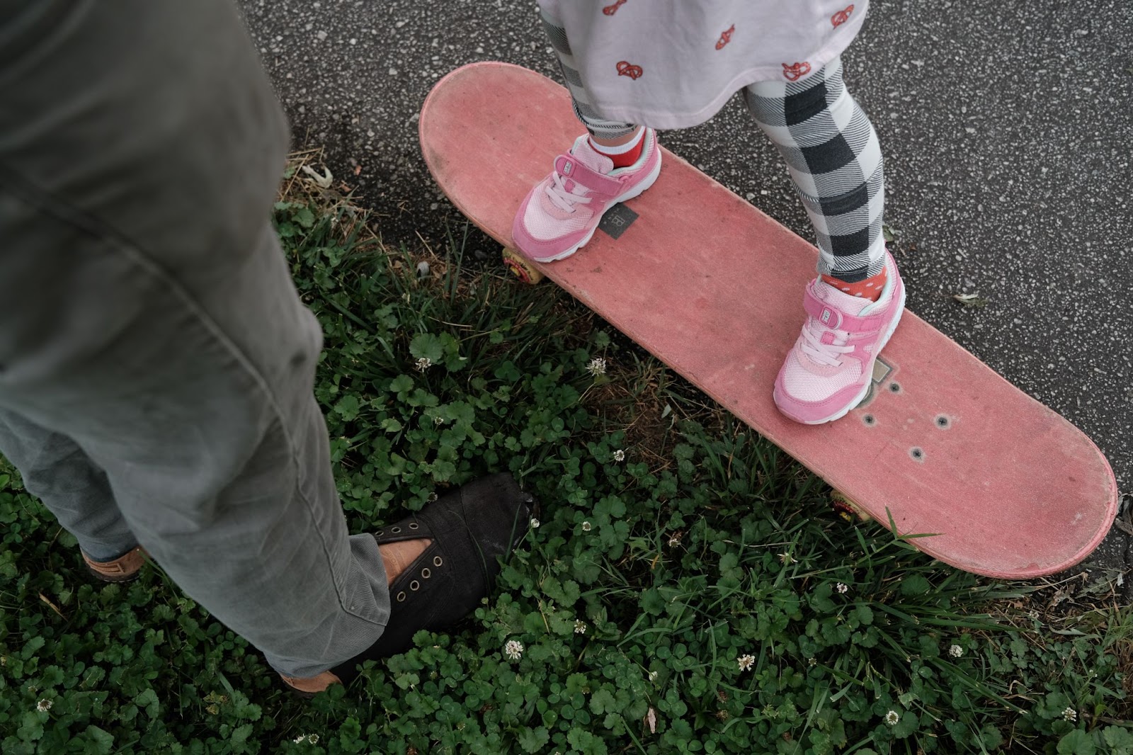 girl practicing riding on a skateboard, fatherhood, bonding, daddy's girl, parenting