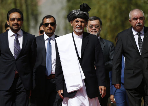 Ashraf Ghani (centre). Picture: EPA/OMAR SOBHANI