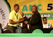 ANC president Cyril Ramaphosa congratulates his new deputy Paul Mashatile at Nasrec Expo Centre in Johannesburg.