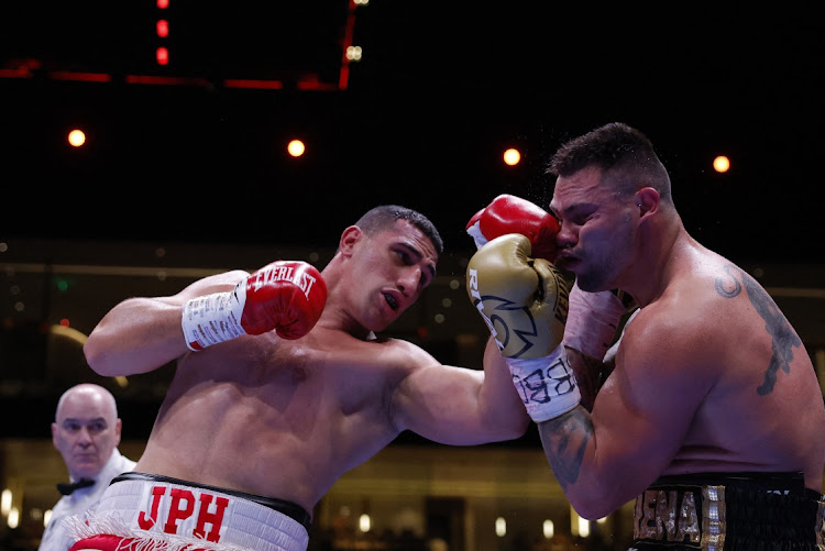 Justis Huni throws a left at Kevin Lerena.