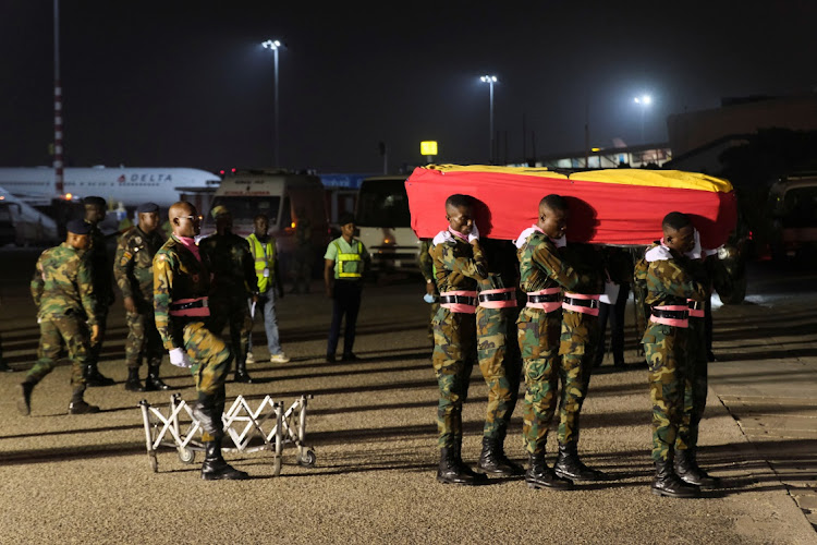 The body of late Ghanaian soccer player Christian Atsu Twasam, 31, who died in the earthquake in Turkey, arrives at the Kotoka International Airport in Accra, Ghana.