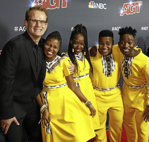 Ralf Schmitt (left) with members of the Ndlovu Youth Choir who featured on 'America's Got Talent'.