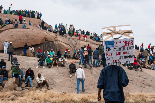 A file photo taken 16 August 2014 shows miners gathered at the kopie in Marikana in comemoration of the 2nd year annivesary since the 34 miners were gunned down by police in 2012 when they were on strike for a wage hike.