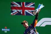 Race winner Daniel Ricciardo of Australia and McLaren F1 celebrates on the podium during the Formula  One Grand Prix of Italy at Autodromo di Monza on September 12, 2021 in Monza, Italy. 