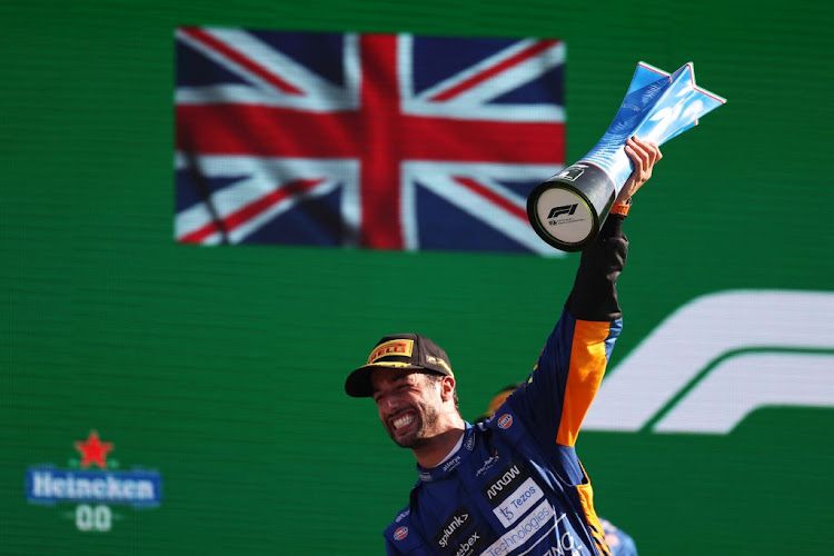 Race winner Daniel Ricciardo of Australia and McLaren F1 celebrates on the podium during the Formula One Grand Prix of Italy at Autodromo di Monza on September 12, 2021 in Monza, Italy.