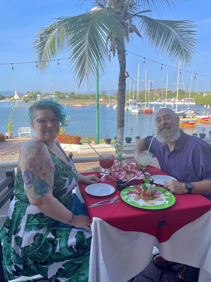 Enjoying our colorful guacamole, cocktails and the beautiful view