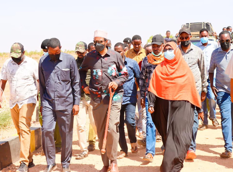 Eldas MP Adan Keynan [C] in Eldas town alongside Education officials, local leaders, parents and students when he attended a Parents' Day event at Eldas Secondary School on Tuesday.