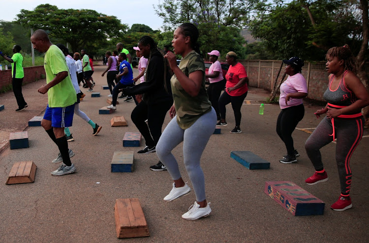 People exercise inside Warren Hills cemetery in Harare, Zimbabwe, November 24 ,2022.