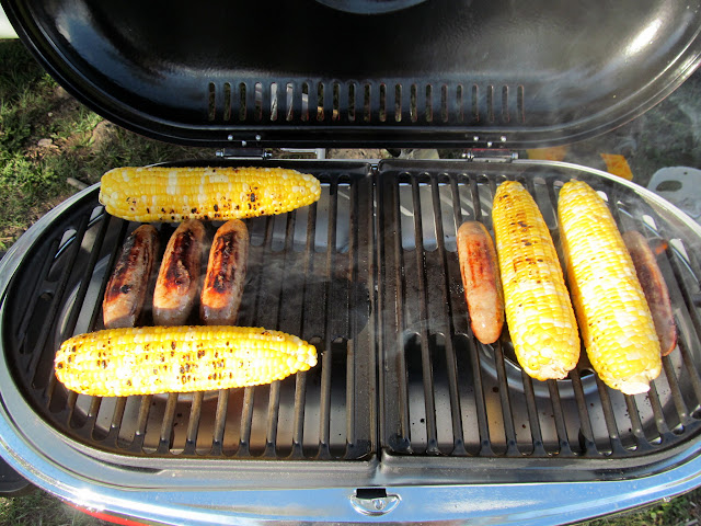 Brats and corn on the grill