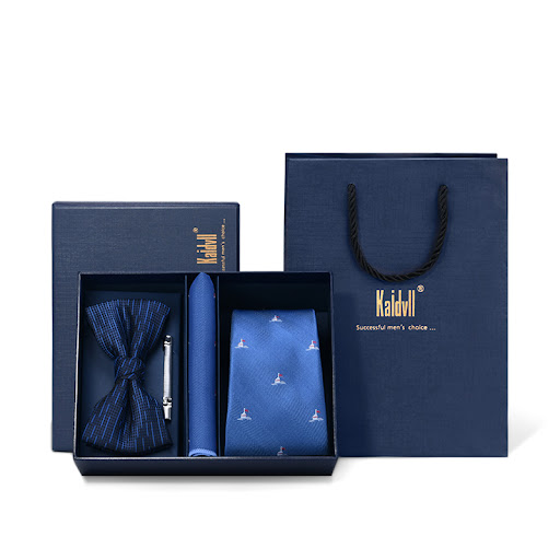 Title 13, Four piece suit with embroidered tie. Achieve a...