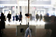 A security personnel wearing a mask to avoid contracting the coronavirus disease (Covid-19) stands guard at a building in Seoul, South Korea, September 24, 2021.    