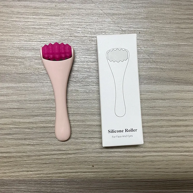 Massageador portátil para olhos com rolo de silicone e creme, reduz olheiras e rugas, promove pele fresca e rejuvenescida, fácil de usar.