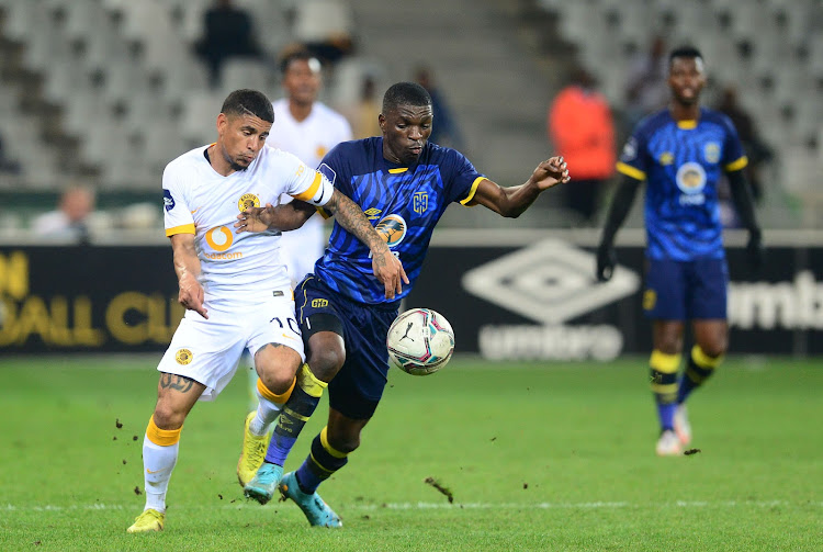 Keegan Dolly of Kaizer Chiefs is challenged by Brice Ambina of Cape Town City in their DStv Premiership match at Cape Town Stadium on August 23 2022.