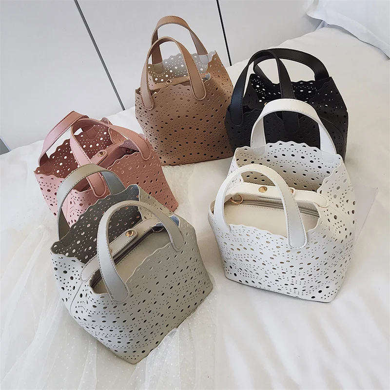 Title 5, Bolsa tiracolo bucket com design versátil de um...