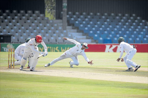 STRETCHING OUT: Lions' Rassie van der Dussen feeling a little cramped for space in the crease against the Warriors at Buffalo Park on Saturday Picture: MARK ANDREWS