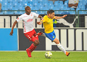 Ali Meza of Sundowns is tackled by Junior Sibande of Highlands during their league match on Wednesday.