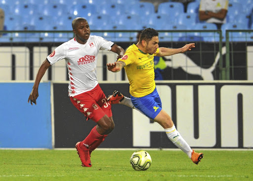 Ali Meza of Sundowns is tackled by Junior Sibande of Highlands during their league match on Wednesday.