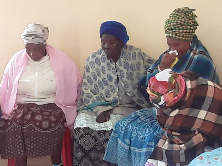 Distraught family members in tears after the horror attack.