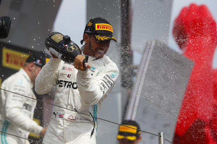 Lewis Hamilton celebrates after winning the French Grand Prix.