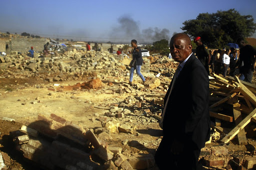 Johannesburg mayor Herman Mashaba has promised to rebuild the destroyed homes despite the structures being built illegally in Alexandra.