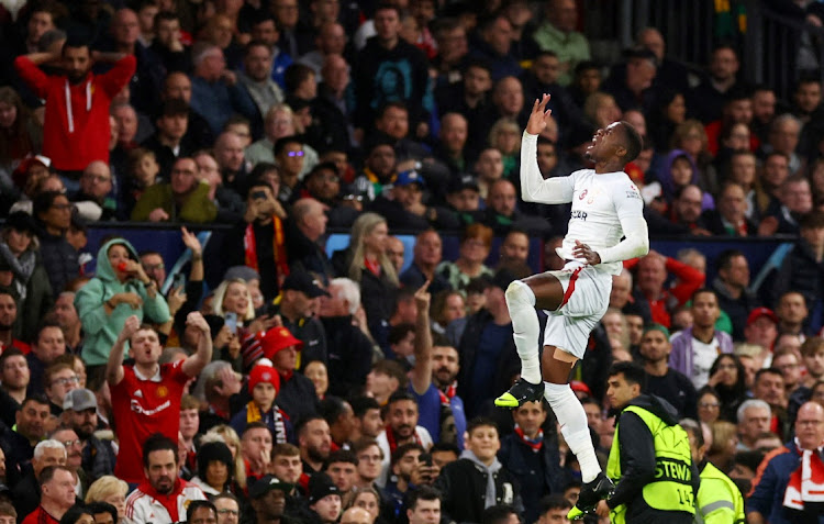 Galatasaray's Wilfried Zaha celebrates scoring their first goal in their Uefa Champions League group A match against Manchester United at Old Trafford in Manchester on Tuesday night.