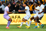 Chiefs players celebrate with Itumeleng Khune of Chiefs after winning the penalty shootout during the MTN8, Quarter Final match between Stellenbosch FC and Kaizer Chiefs.