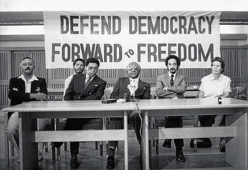 COMRADES IN ARMS: Professor Jakes Gerwel (second from right) with (from left) Frank van der Horst, Lionel Louw, Allan Boesak, Desmond Tutu and Mary Burton at a Defend Democracy campaign at a the height of apartheid repression in the late 1980s Picture: GALLO IMAGES/ORYX MEDIA ARCHIVE