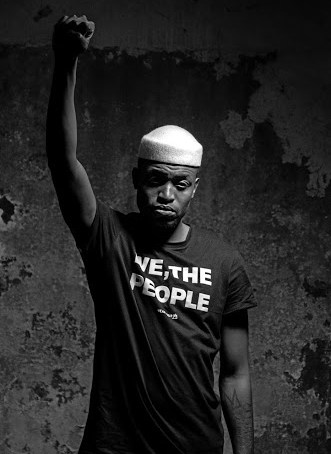 Fashion designer Tshepo Mohla models his "We, The People" T-shirt.