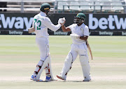 Proteas Temba Bavuma and Rassie van der Dussen celebrate the team's series win against India at Newlands on Friday.