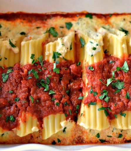 A super easy and fun three cheese and garlic stuffed manicotti that can prepped up to two days in advance for busy families.