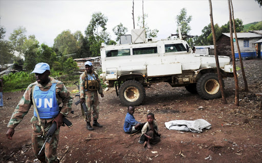 South African National Defence Force soldiers patrolling the streets on April 20 , 2013, in Goma, Democratic Republic of Congo.