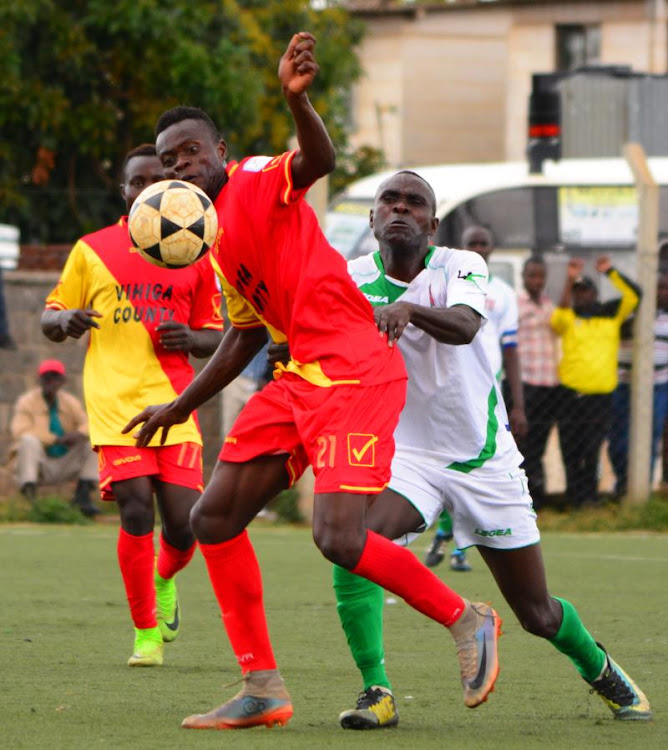 Vihiga United's Junior Adeyefa shields the ball from Riro Mokaya of AP during their NSL match at Camp Toyoyo on October 8,2019.