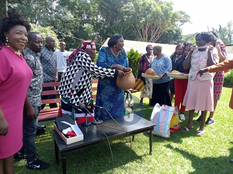 Field Marshal Muthoni Kirima and her descendants present gifts to former First Lady Mama Ngina Kenyatta at her Muthaiga home on April 20, 2023.