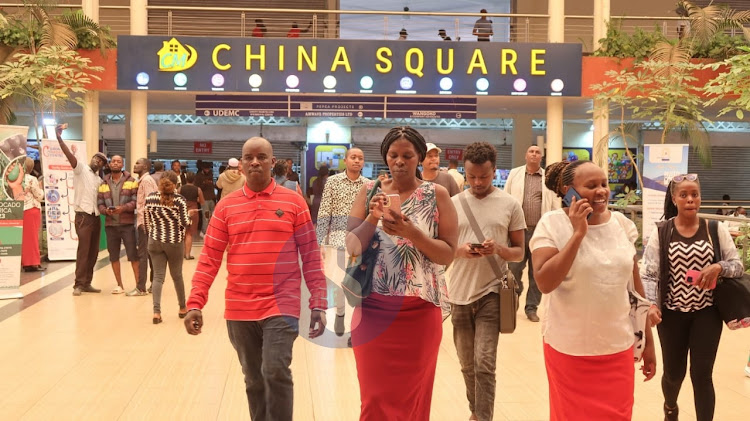 Consumers walking out of China Square after it resumed normal operation in Unicity Mall on March 7, 2023.