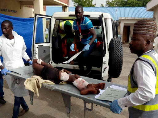 A victim of the bomb blast in Damboa is taken on a stretcher into the accident and emergency ward at the specialist hospital in Maiduguri, Nigeria June 17, 2018. /REUTERS